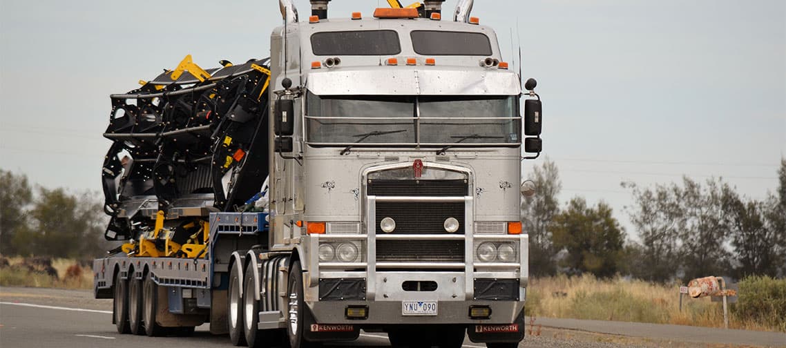 Oversize load under escort on a country highway