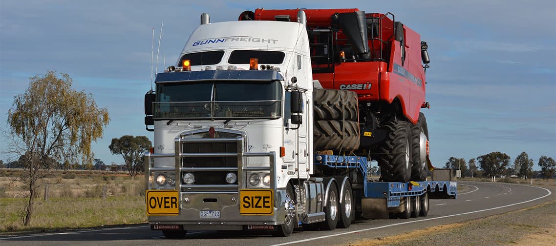 Case header on a low loader